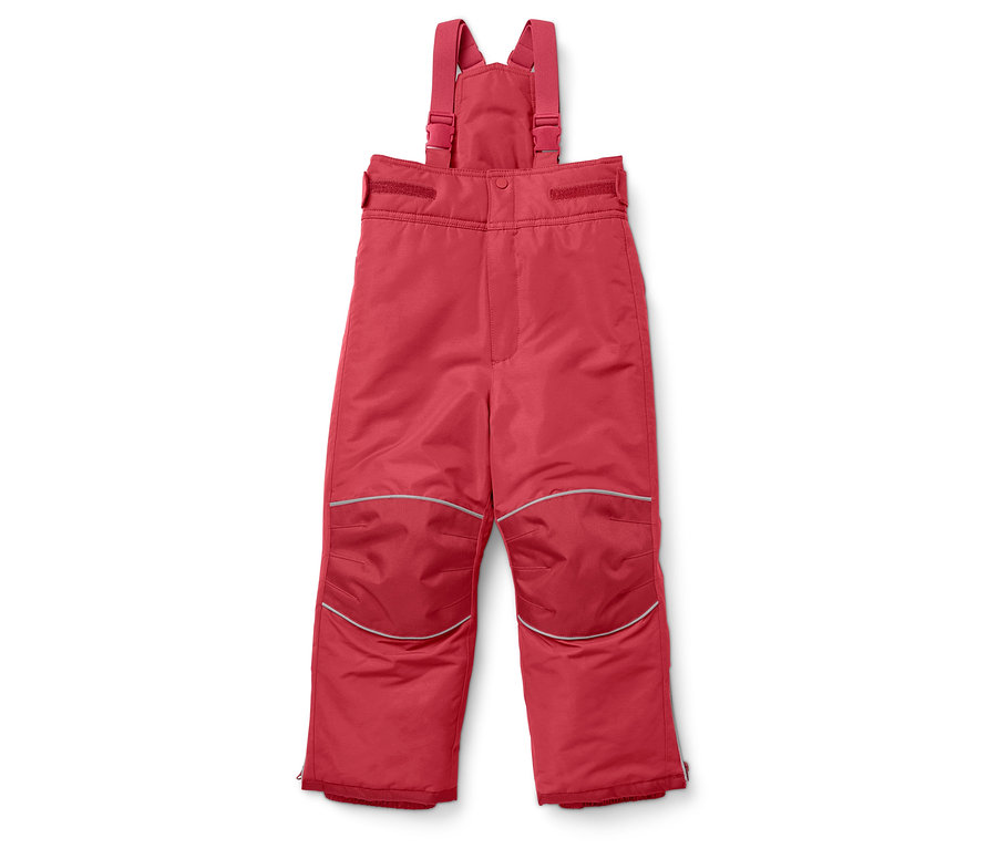 Un pantalon de ski rouge pour enfant avec une bavette posé sur un fond blanc.