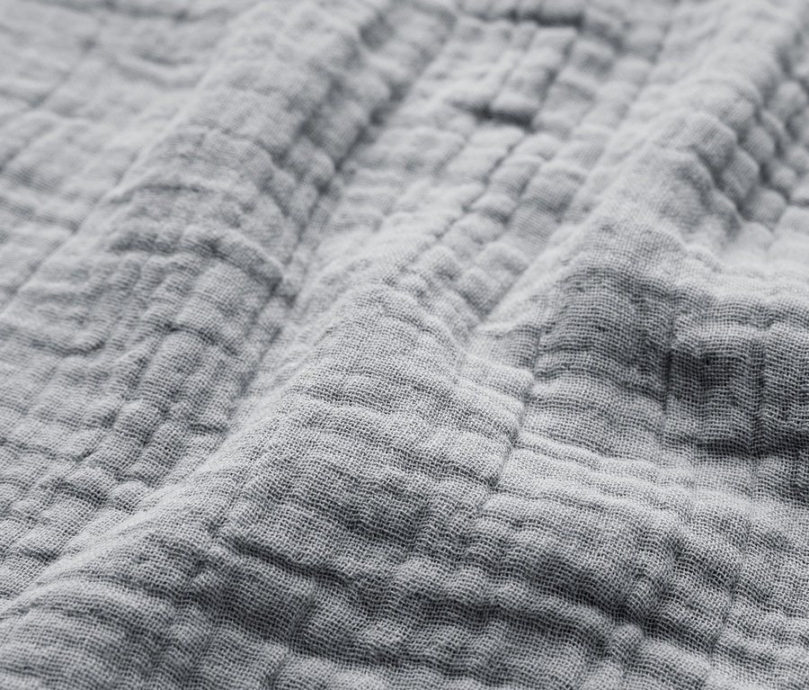 Gros plan d'un tissu gris texturé