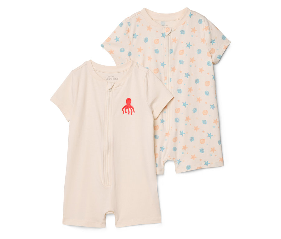 Deux combinaisons de bébé à manches courtes sont superposées, l'une avec une pieuvre rouge et l'autre avec un motif de coquillages et d'étoiles.