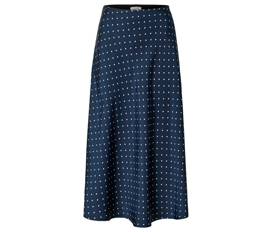 Jupe bleu marine à pois blancs, coupe évasée.