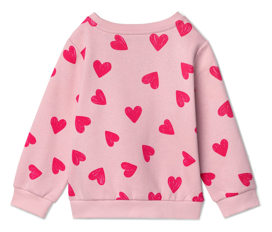 Vue arrière d'un pull rose clair avec un motif de cœur rouge.