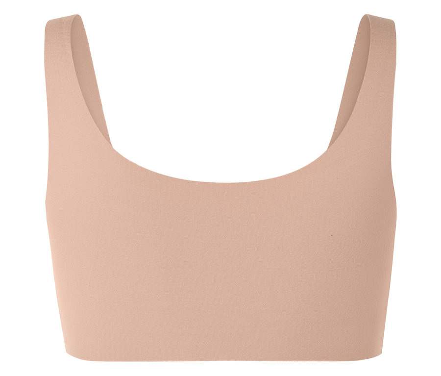 Haut de sport couleur pêche à larges bretelles.