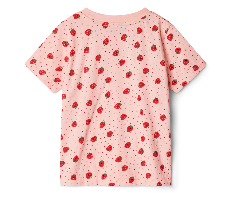 Un t-shirt rose avec un motif de fraises et des points rouges.
