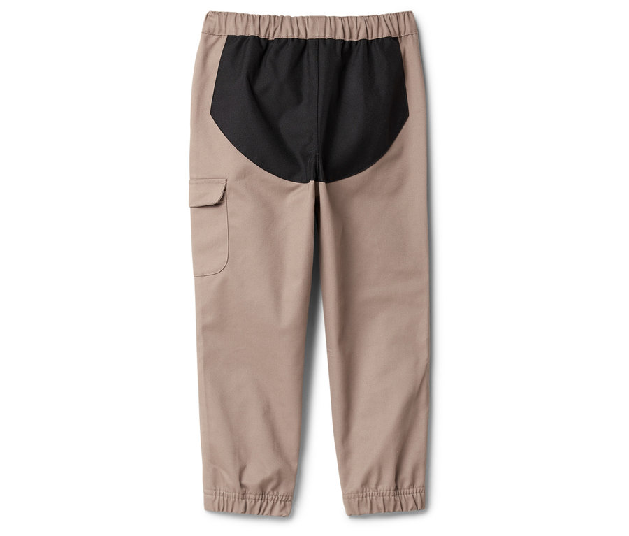 Pantalon beige avec taille élastique et empiècement noir à l'arrière.