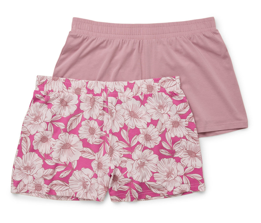 Deux shorts l'un sur l'autre : un rose uni, l'autre rose avec un motif floral blanc.