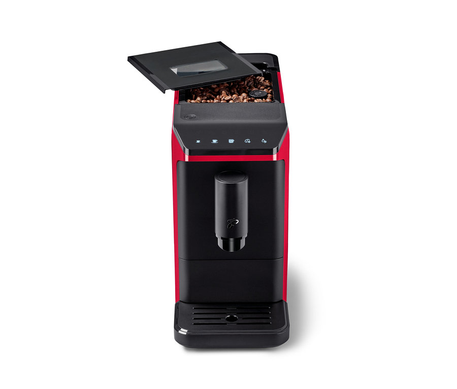 Machine à café entièrement automatique « Esperto mini », Lovely Red, rouge et noire, avec le couvercle supérieur ouvert, révélant des grains de café. Un panneau de commande noir et un distributeur de café sont visibles.
