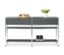 Deux consoles en métal gris « CN3 » avec 2 tiroirs chacune, décorées avec des décorations et une paire de chaussures, sont placées l'une à côté de l'autre.