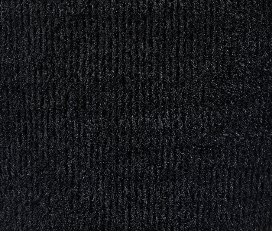 Gros plan sur la texture d'un legging doublé noir.