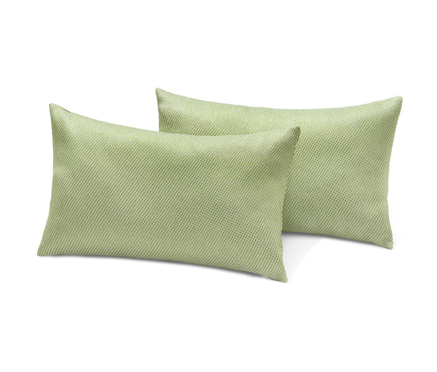 Deux coussins d’extérieur verts l’un sur l’autre.