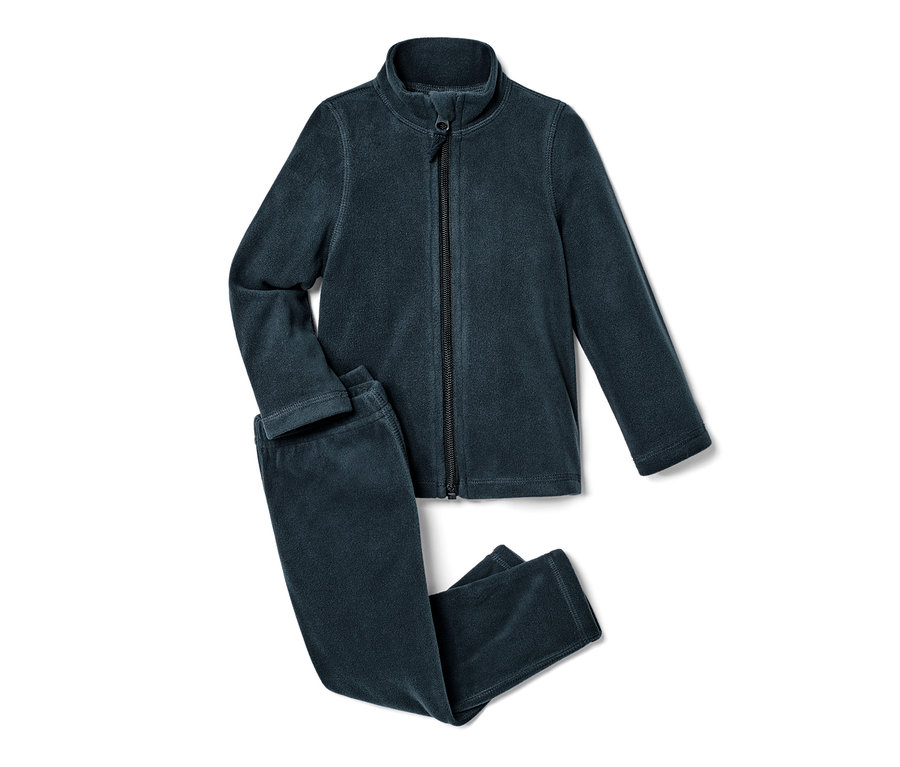 Une combinaison en polaire pour tout petit, en 2 parties, est posée sur un fond blanc.