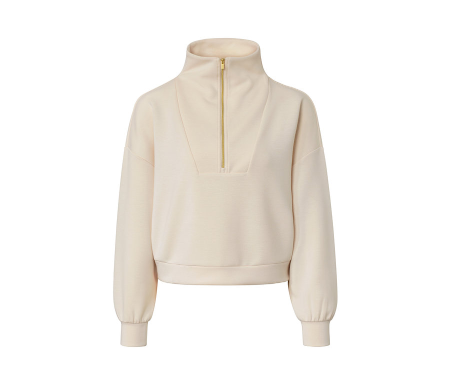 Un pull troyer premium beige avec des manches longues et une fermeture éclair dorée.
