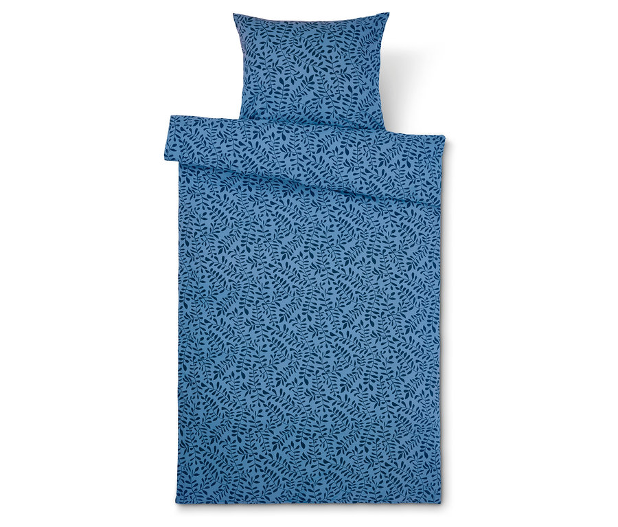 Linge de lit bleu avec motif de feuilles et oreiller.