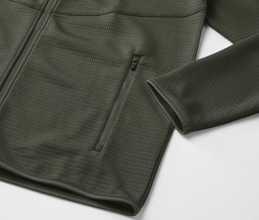 Veste fonctionnelle kaki avec fermeture éclair sur le devant et poche zippée.