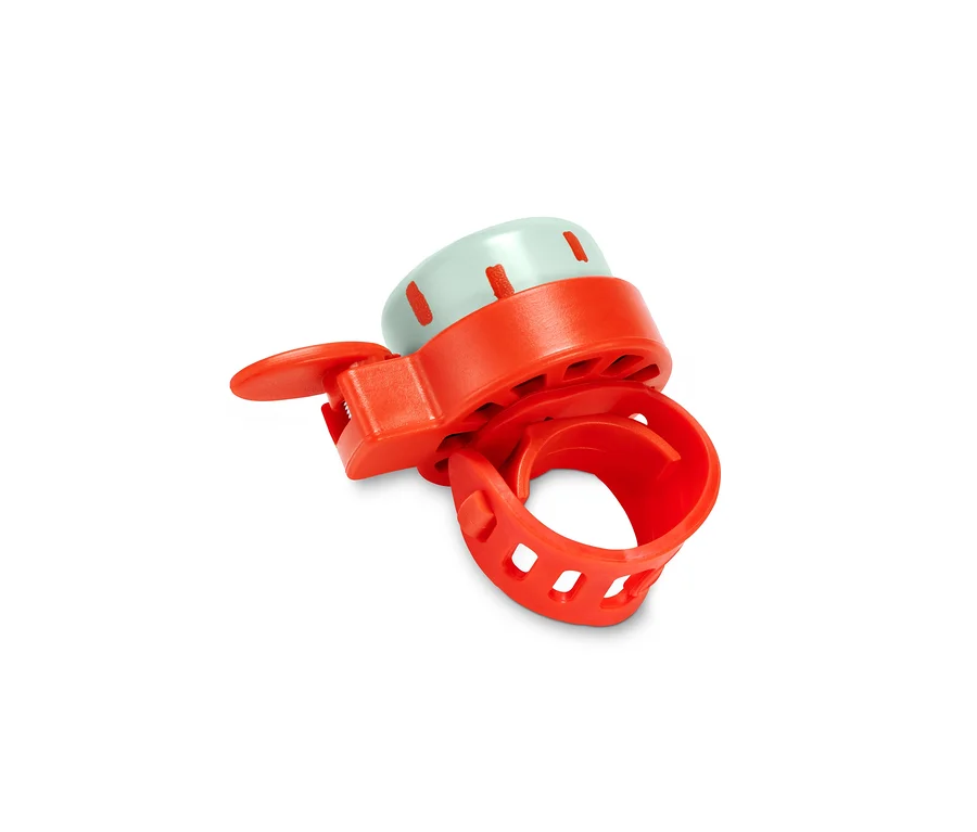 Gros plan d'une sonnette de vélo du kit de décoration pour vélo, avec un support orange et un dessus bleu clair.