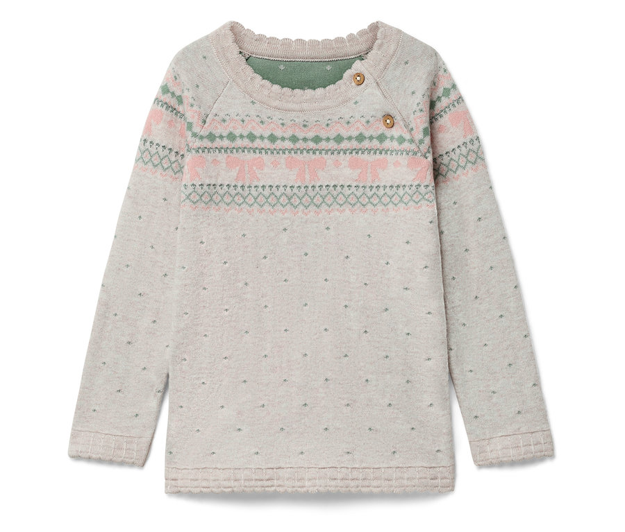 Pull à manches longues avec motif rose et vert sur la poitrine et petits points sur tout le pull.