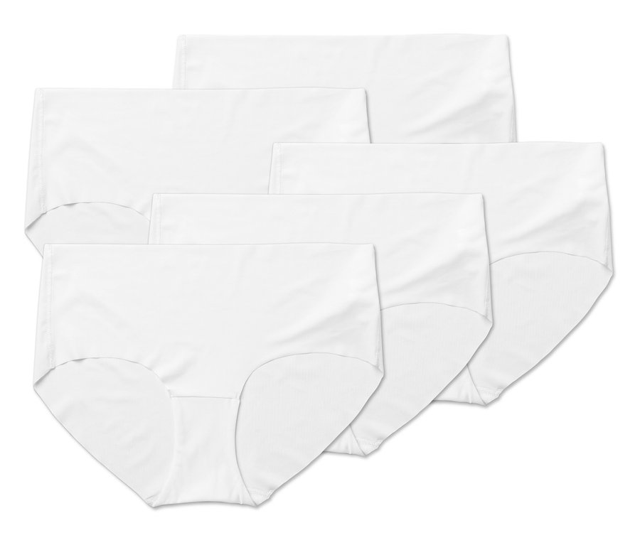Cinq culottes blanches pour femmes sont empilées les unes sur les autres.