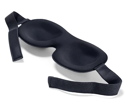 Un masque de sommeil noir sur un fond blanc.