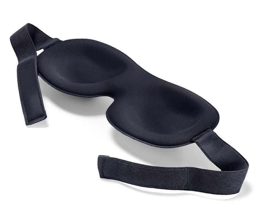 Un masque de sommeil noir sur un fond blanc.