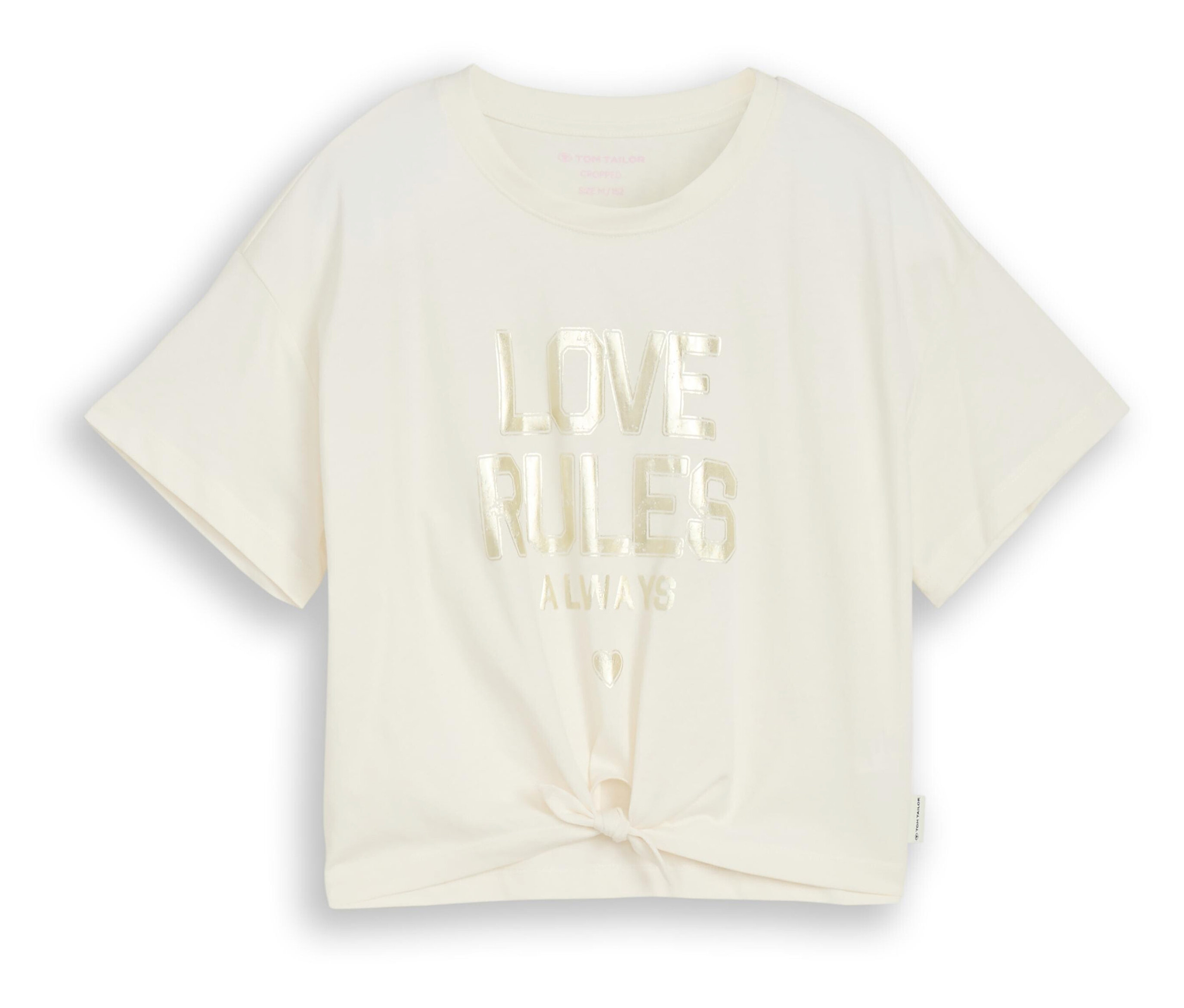 Un t-shirt crème avec l'inscription « Love Rules Always » et un nœud sur le devant.