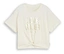 Un t-shirt crème avec l'inscription « Love Rules Always » et un nœud sur le devant.