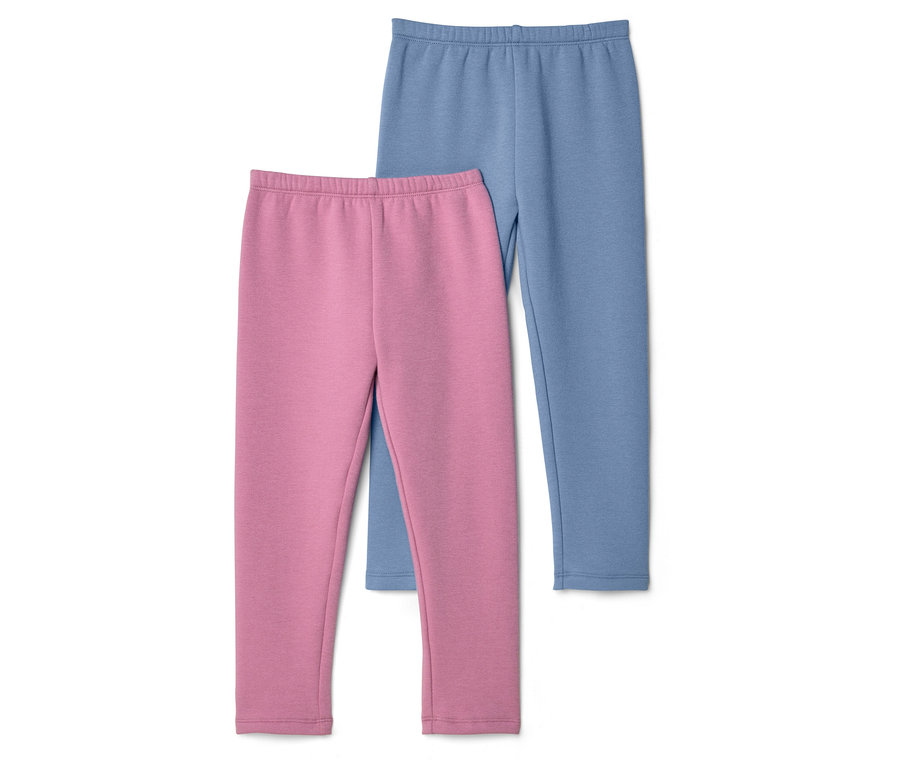 Un legging rose est posé devant un legging bleu sur fond blanc.
