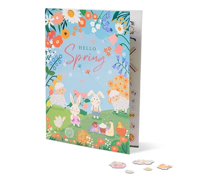Illustration d'un livre intitulé "Hello Spring" avec des moutons, des lapins, des fleurs et une couverture de pique-nique.