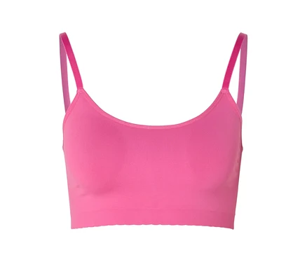 Brassière sans coutures rose vif avec dentelle et fines bretelles sur fond blanc.