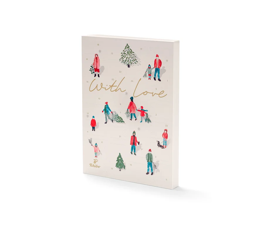 Gros plan sur un calendrier de l'Avent Tchibo orné de motifs hivernaux dessinés.