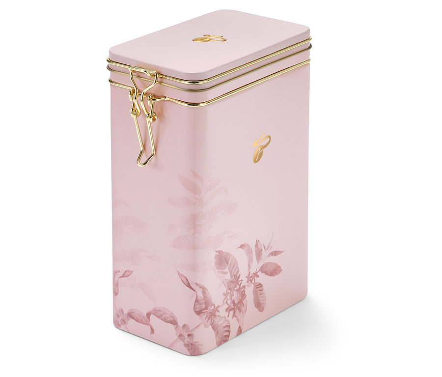 Boîte pour café rose avec motif floral et fermeture dorée.
