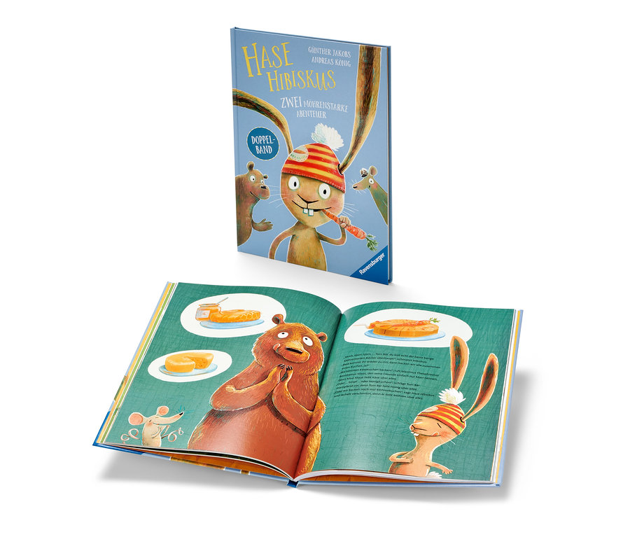 Un livre ouvert « Hase Hibiskus » montre une illustration d'un ours et d'un lièvre. Un livre fermé « Hase Hibiskus » est posé sur le dessus.