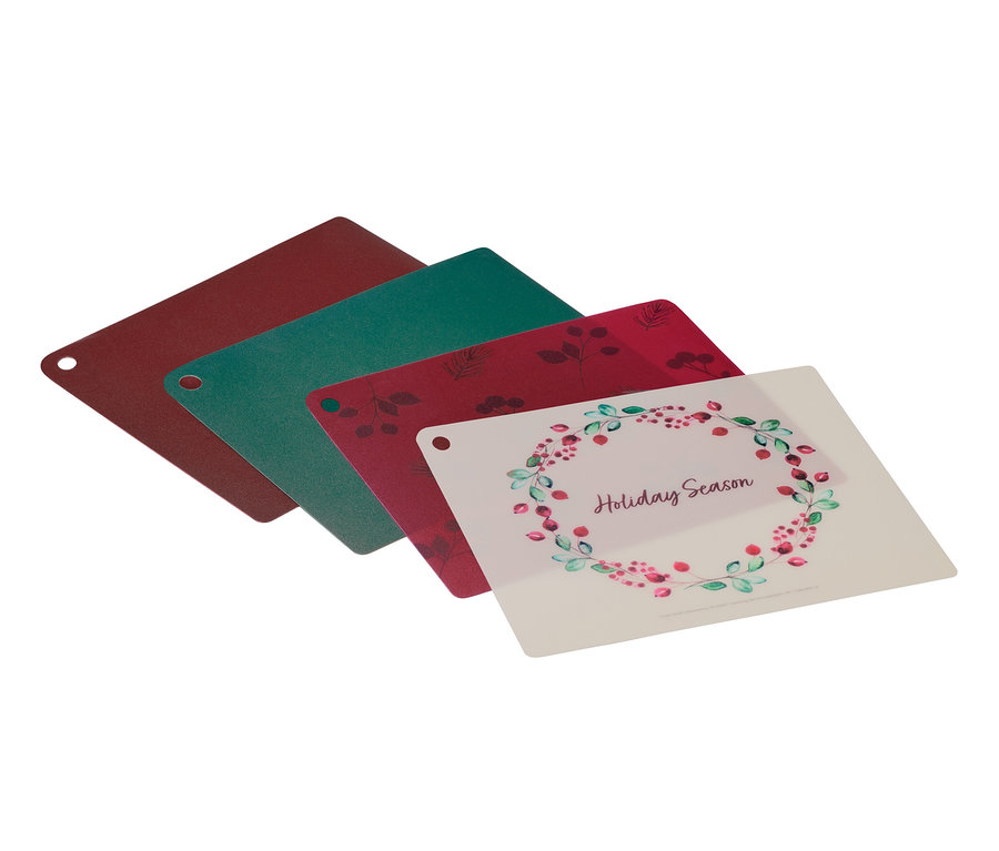 Quatre planches à découper sont disposées en éventail.