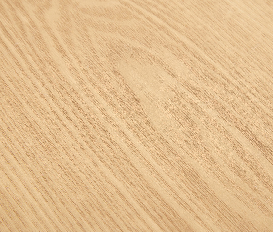 Gros plan sur la texture d'un bois clair.