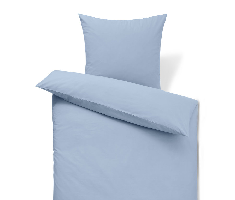 Ensemble de literie bleu clair avec oreiller.