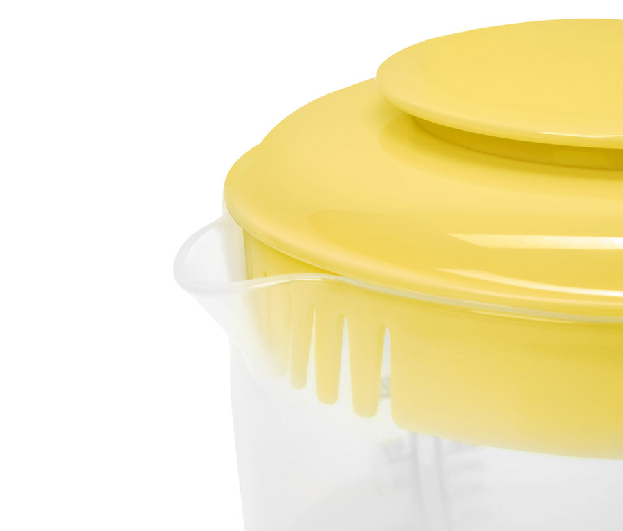 Couvercle jaune sur un récipient transparent avec des mesures.