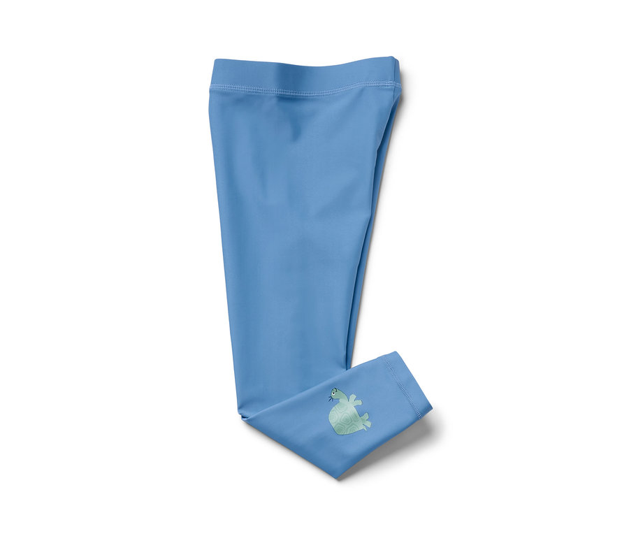 Legging de bain bleu clair pour enfant avec protection UV 80, avec une image de tortue sur une jambe.
