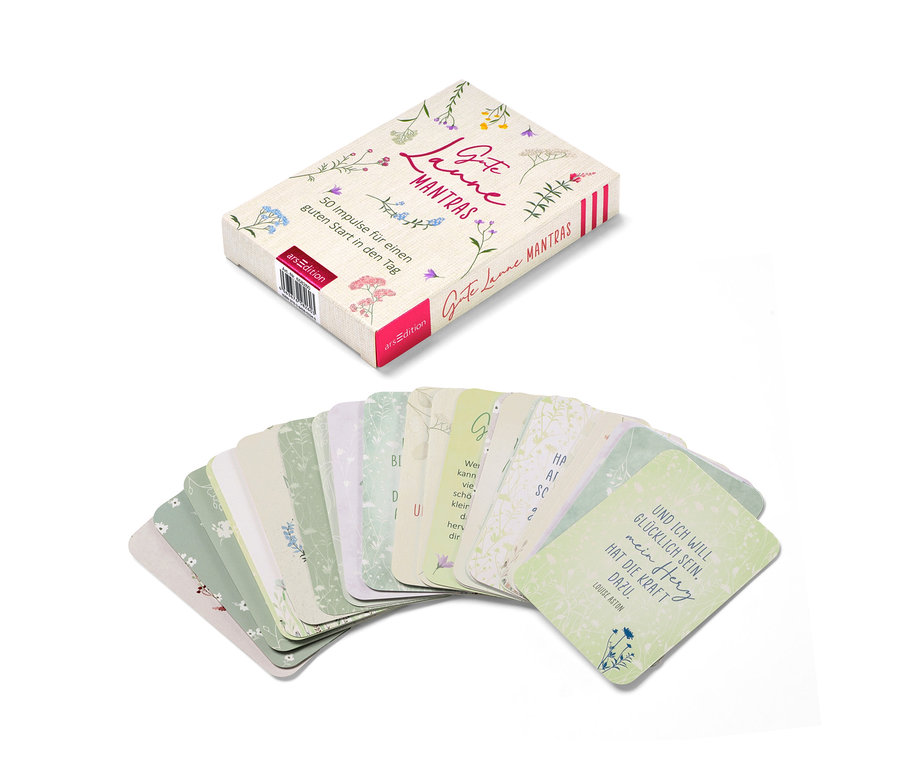 Un set de cartes de mantras et des cartes étalées.