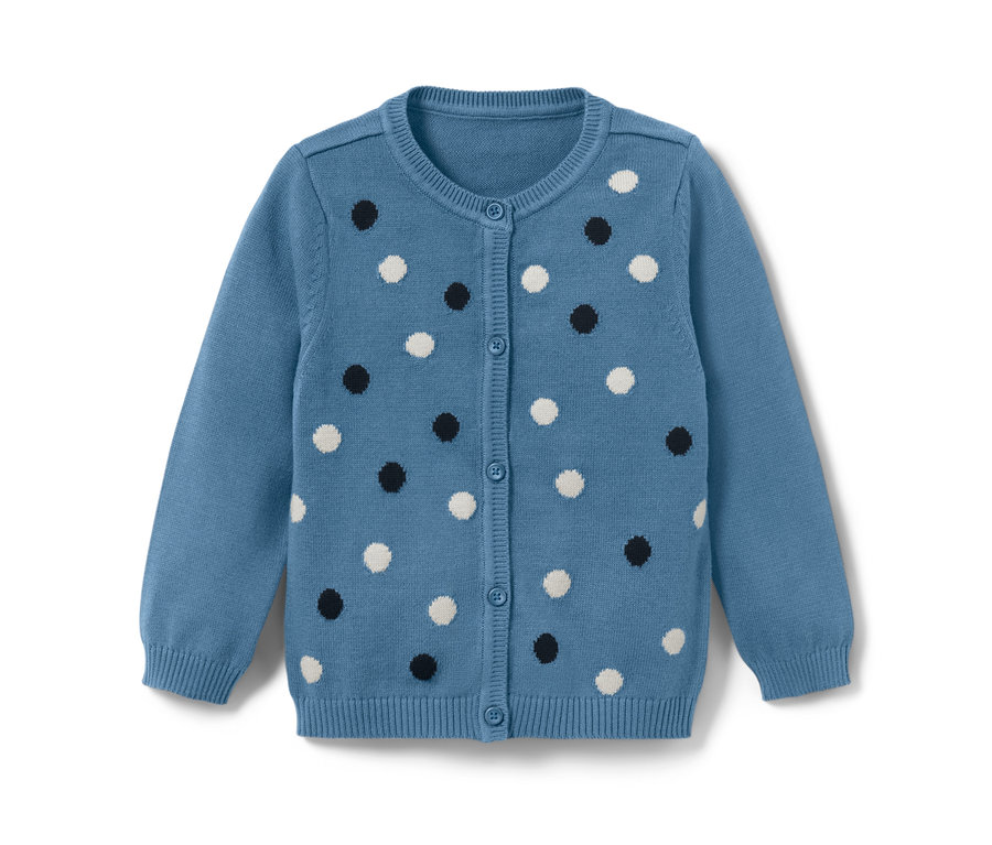 Un gilet en maille bleu clair pour tout-petit avec des pois blancs et noirs.
