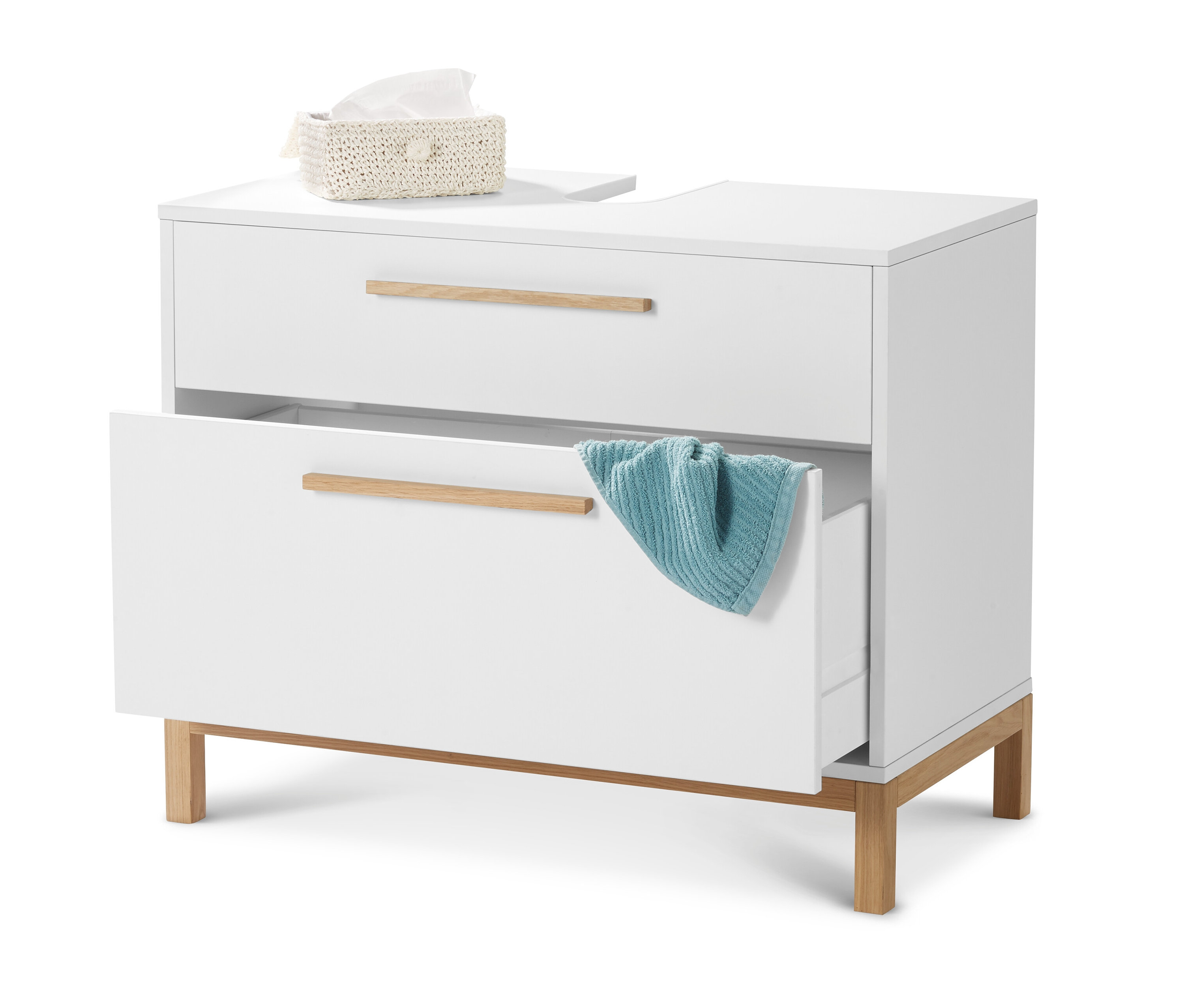 Meuble sous vasque « Eklund » blanc à 2 tiroirs dont un ouvert avec une serviette bleue. Une boîte de mouchoirs est posée sur le dessus.