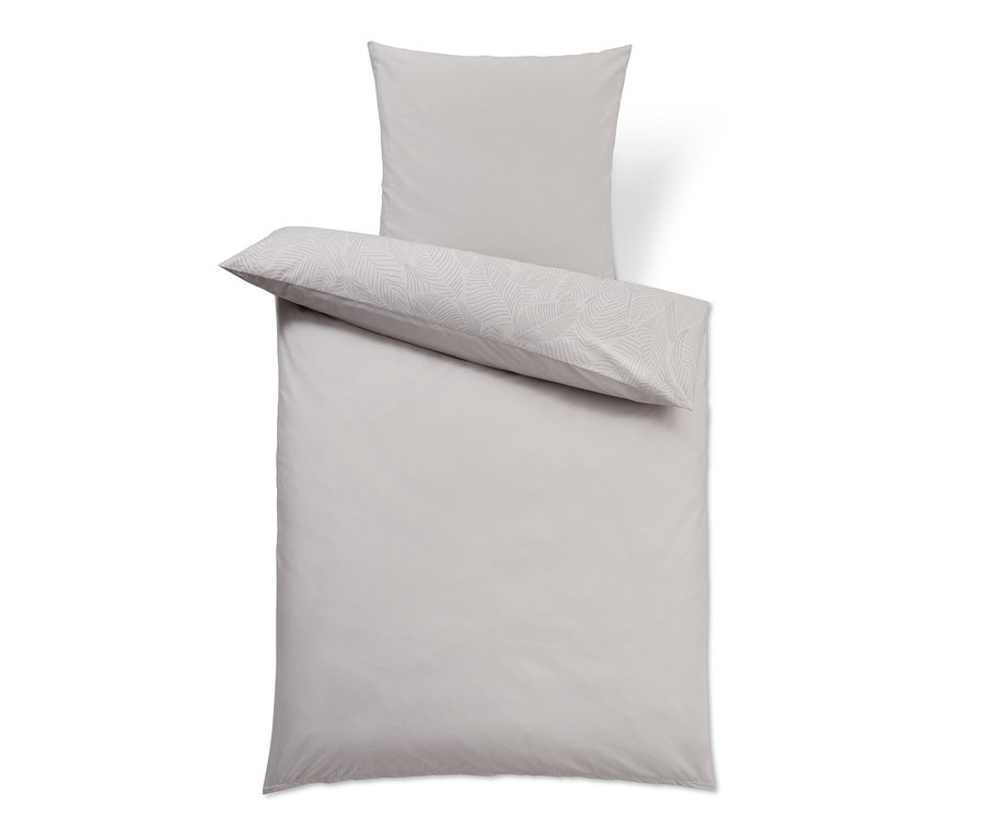 Parure de lit en coton premium grise taille standard avec un motif de feuilles blanches et un oreiller gris.