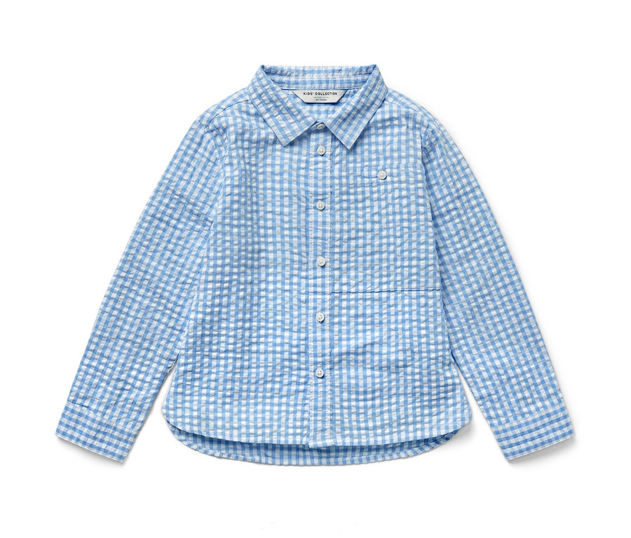 Chemise pour enfant à carreaux bleu clair à manches longues.