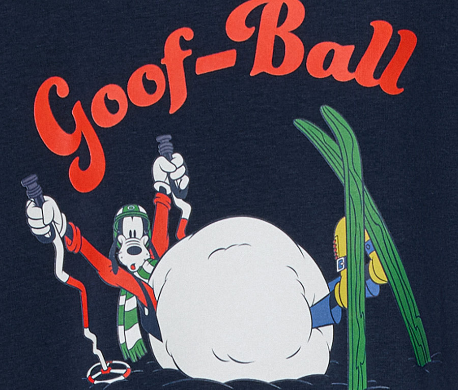 Personnage de dessin animé, Goofy, avec équipement de ski dans une scène enneigée avec l'inscription "Goof-Ball".