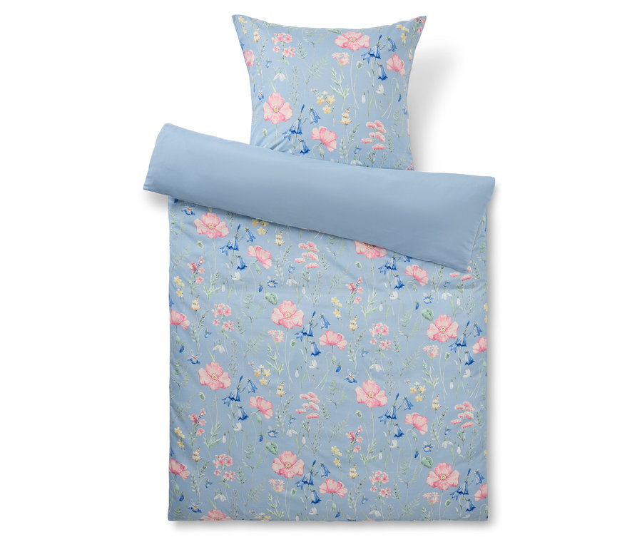 Ensemble de literie bleu à motif floral composé d'une taie d'oreiller et d'une housse de couette.