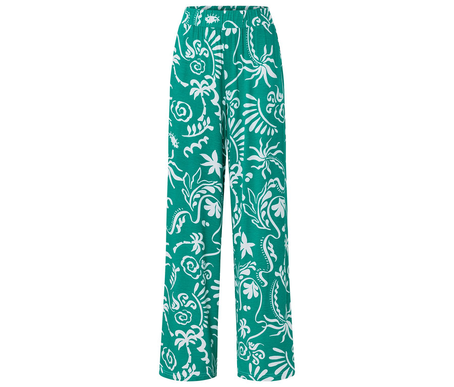 Pantalon vert ample avec motif blanc.