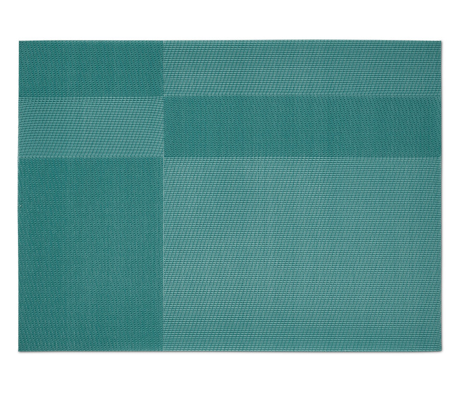 Un napperon vert avec un motif géométrique.