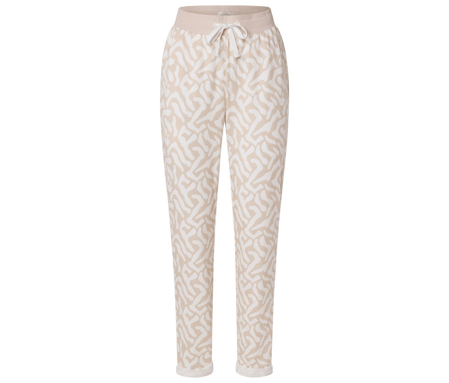 Pantalon beige à motifs abstraits blancs et cordon de serrage à la taille.