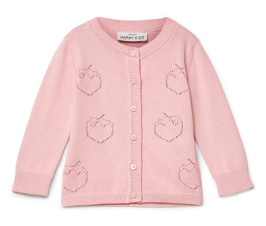 Cardigan rose à motif de pommes.