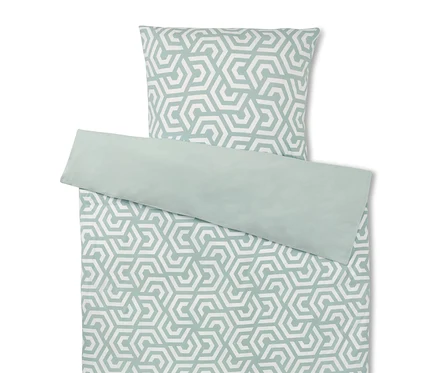 Ensemble de literie avec motif géométrique en blanc et vert.