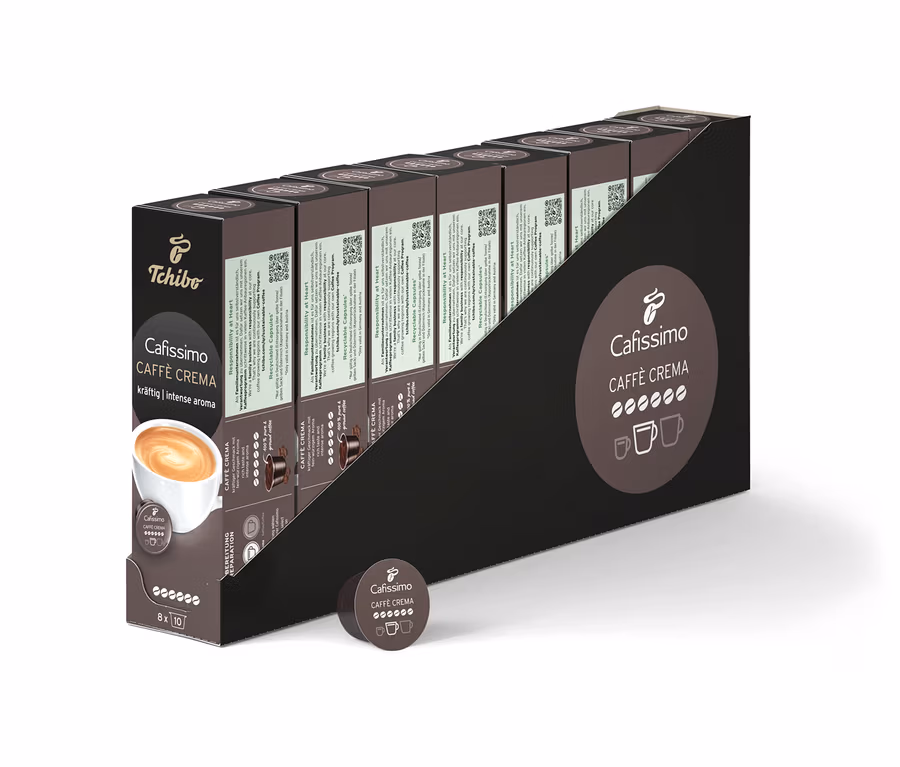 Une boîte de Cafissimo Caffè Crema Kräftig (corsé) – 80 capsules est visible. L'emballage montre une tasse de café.