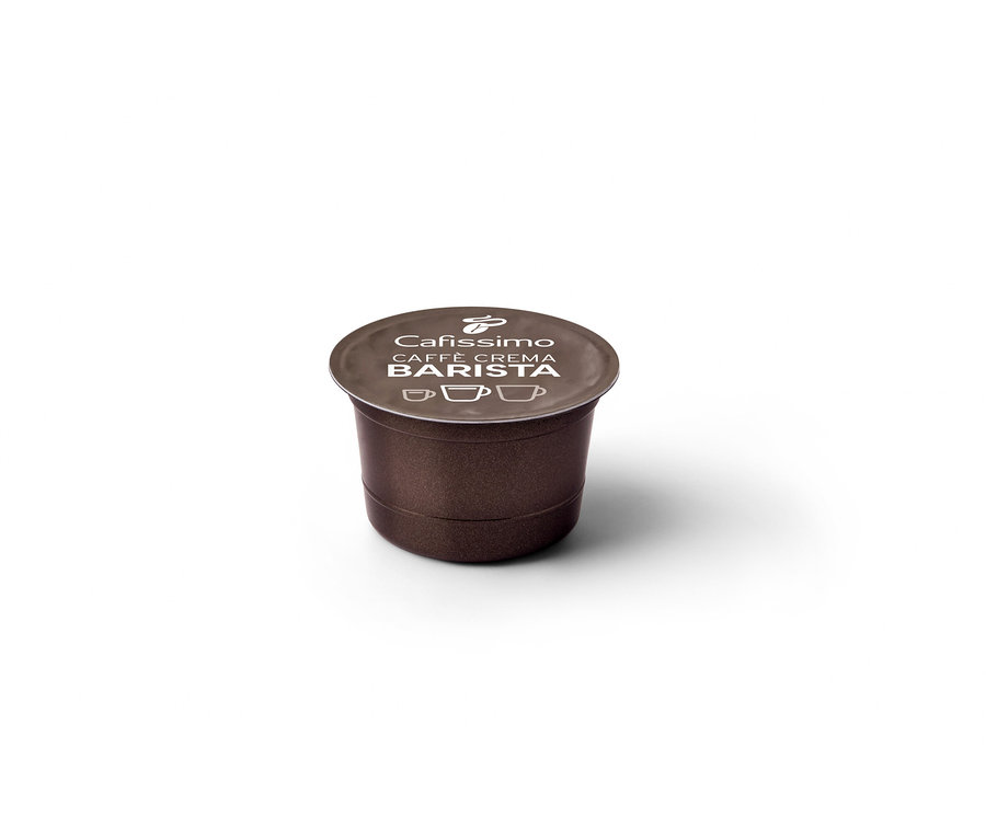 Gros plan sur une capsule individuelle marron Cafissimo Barista Caffè Crema.