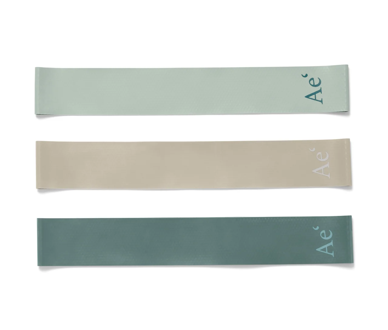 Trois mini-bandes de résistance en vert, beige et vert foncé.